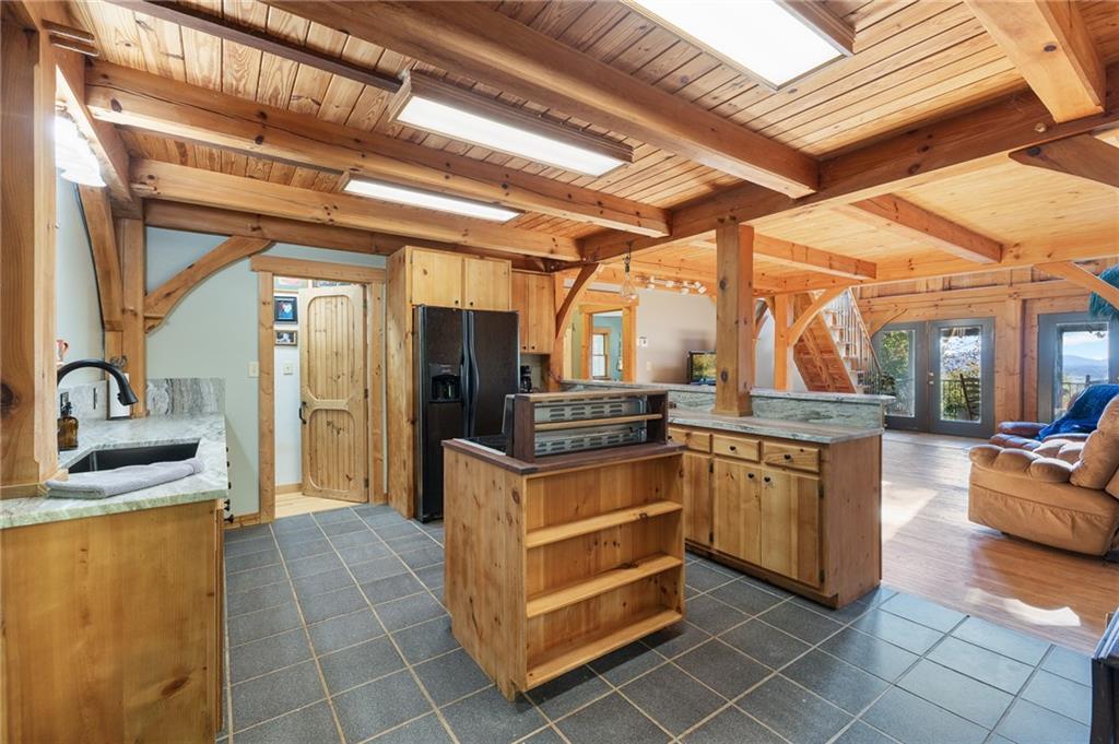 339 Cameron Road Cleveland, GA 30528 - Photo 19 of 36 a kitchen with stainless steel appliances granite countertop a sink and a refrigerator