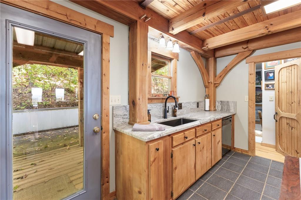 339 Cameron Road Cleveland, GA 30528 - Photo 20 of 36 a bathroom with a granite countertop sink and a mirror