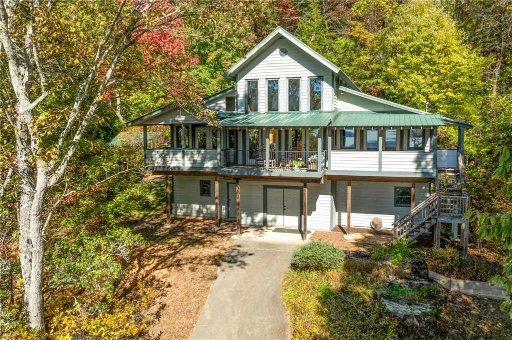 339 Cameron Road Cleveland, GA 30528 - Photo 2 of 36 a front view of a house with a yard