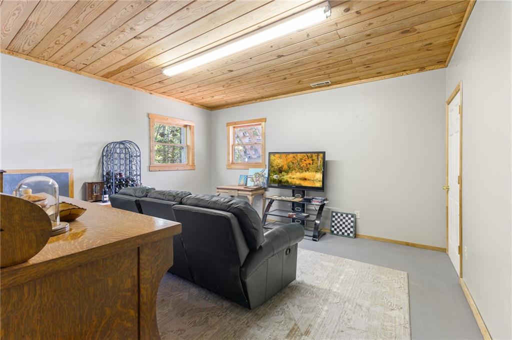 339 Cameron Road Cleveland, GA 30528 - Photo 34 of 36 a living room with furniture and a flat screen tv