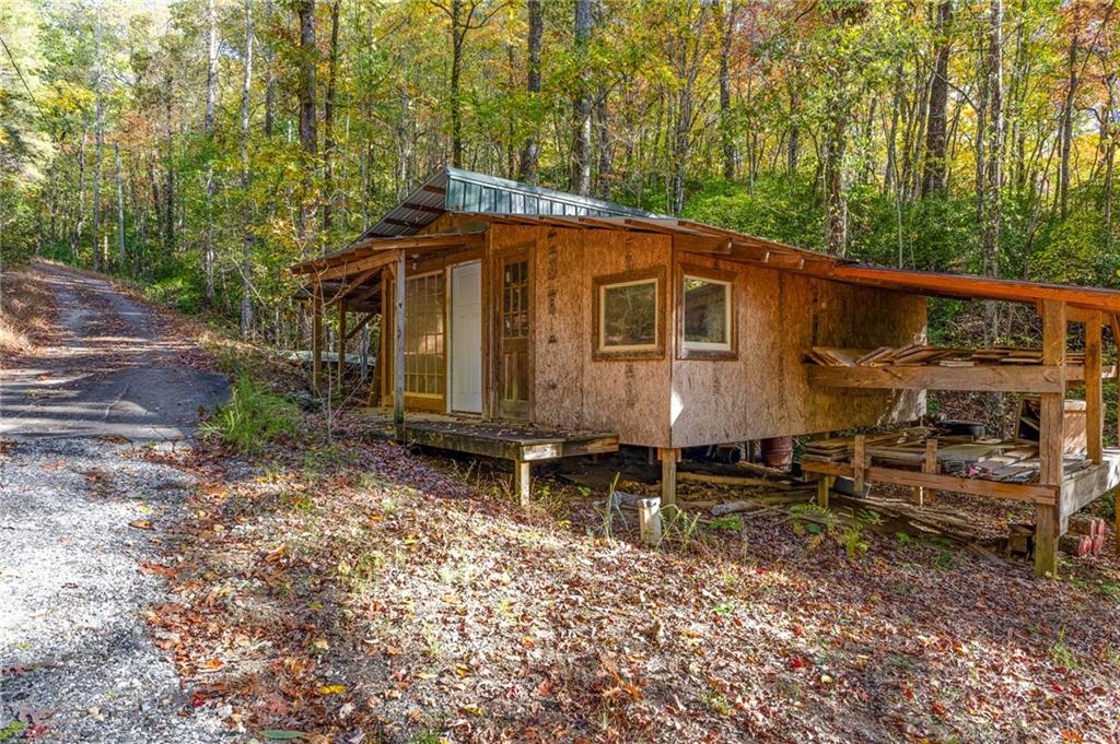 339 Cameron Road Cleveland, GA 30528 - Photo 35 of 36 a backyard of a house with table and chairs