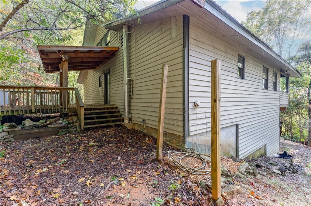 339 Cameron Road Cleveland, GA 30528 - Photo 7 of 36 a view of a house with a yard and wooden fence