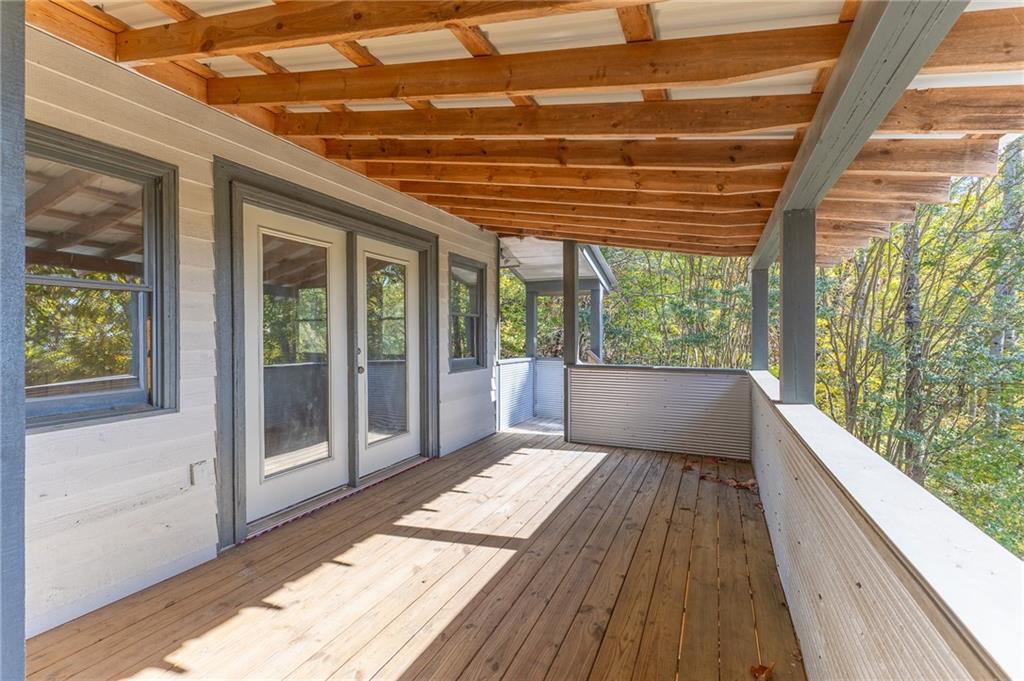 339 Cameron Road Cleveland, GA 30528 - Photo 10 of 36 a balcony with wooden floor