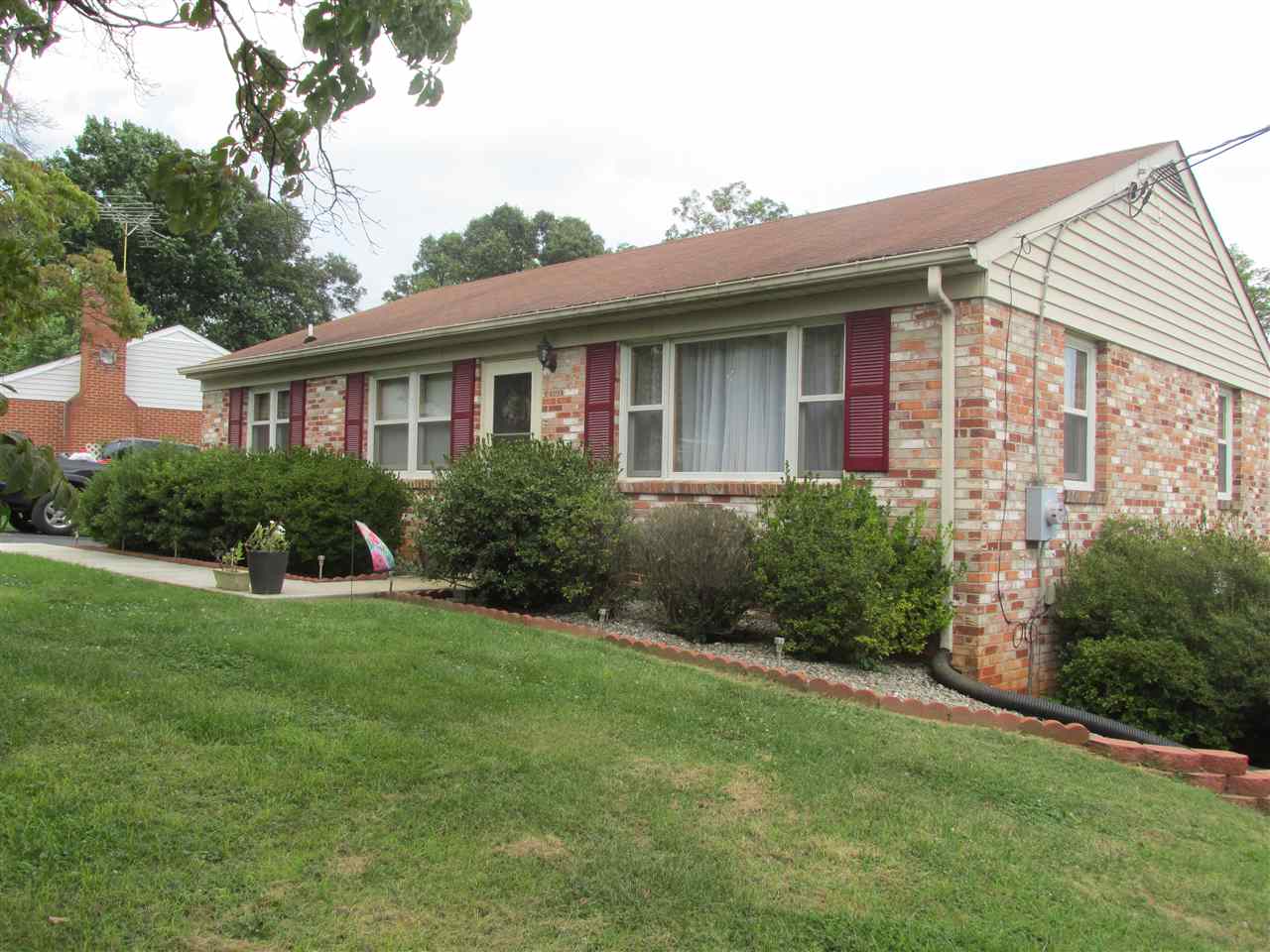 318 Locust Lane Ruckersville, VA 22968 - Photo 2 of 8 a front view of a house with a yard and trees