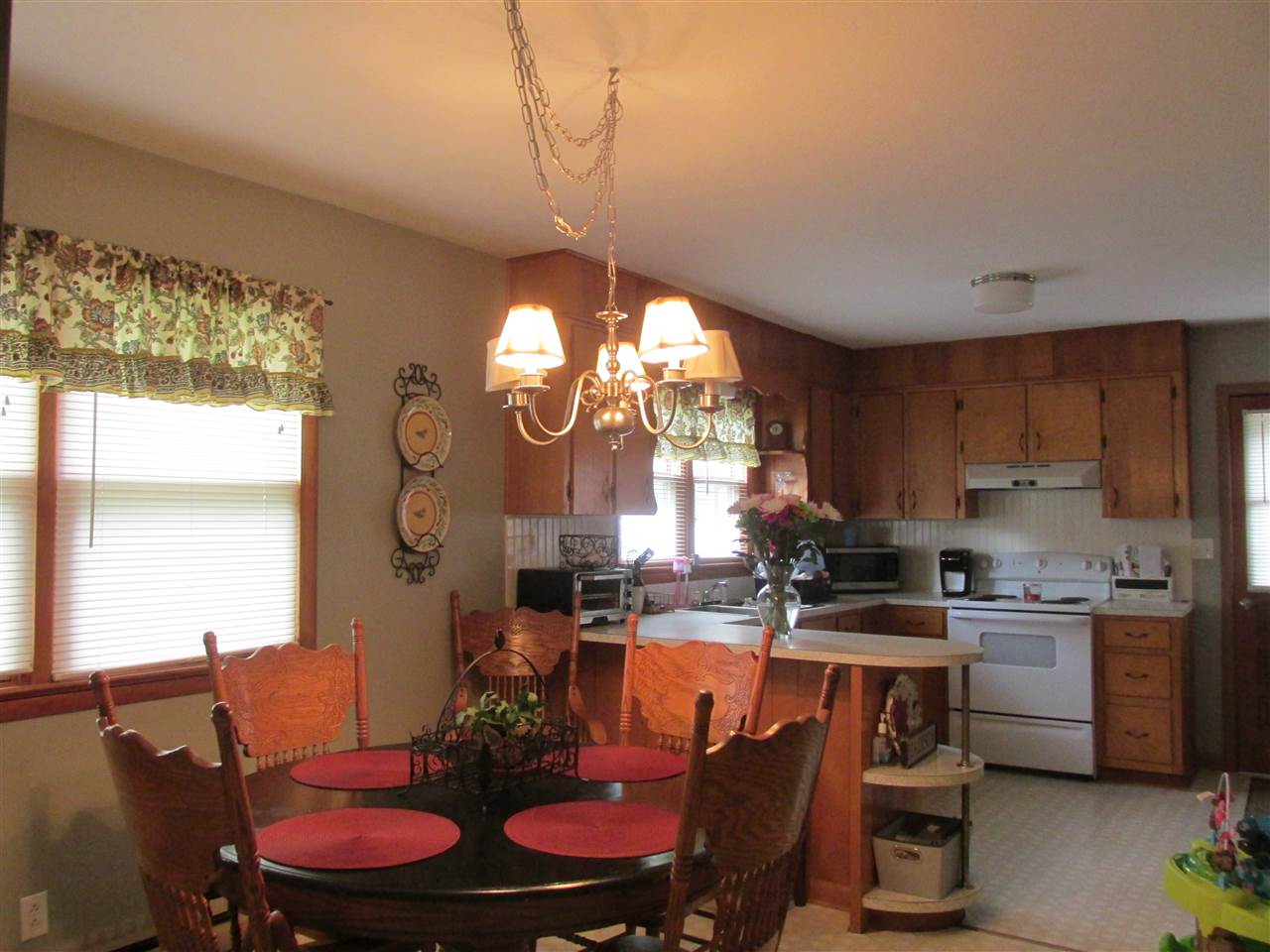 318 Locust Lane Ruckersville, VA 22968 - Photo 4 of 8 a view of a dining room with furniture a chandelier and window
