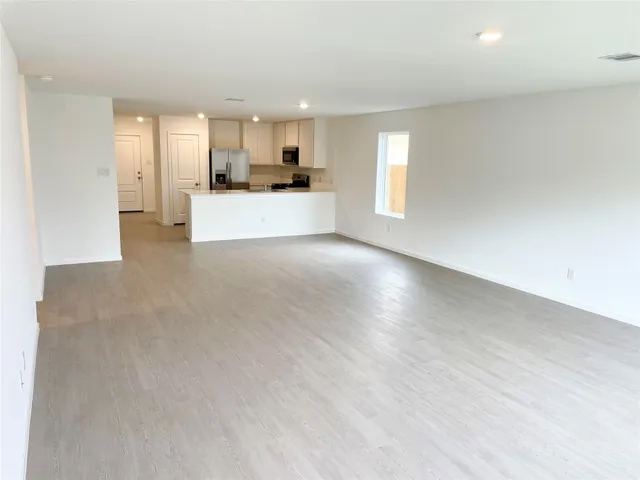 a view of a kitchen with a sink and a stove top oven