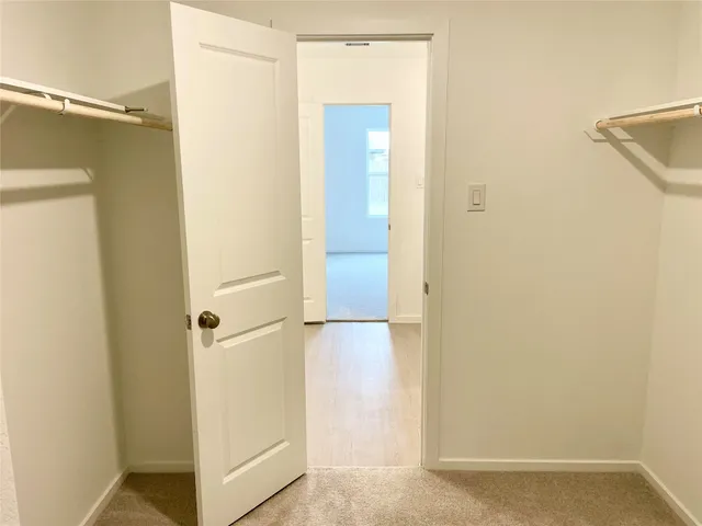 a view of bathroom with a shower and a glass door