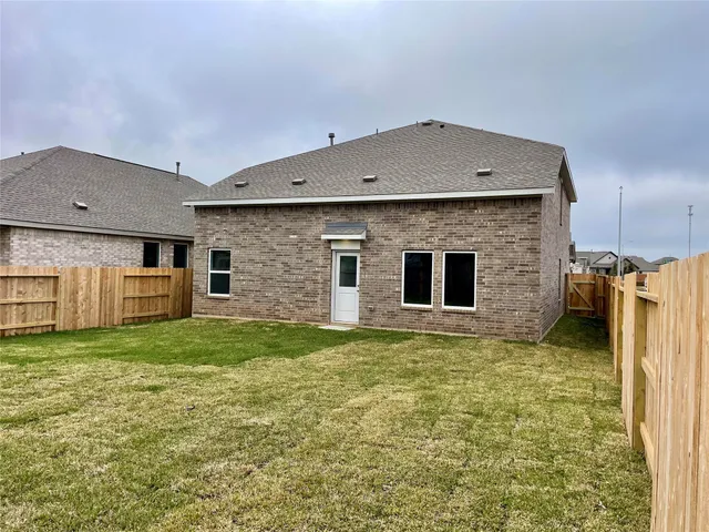 a view of a backyard of the house