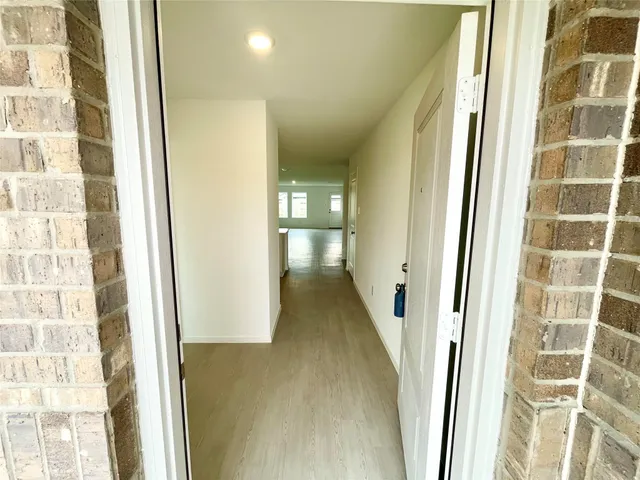 a view of a hallway with a white walls