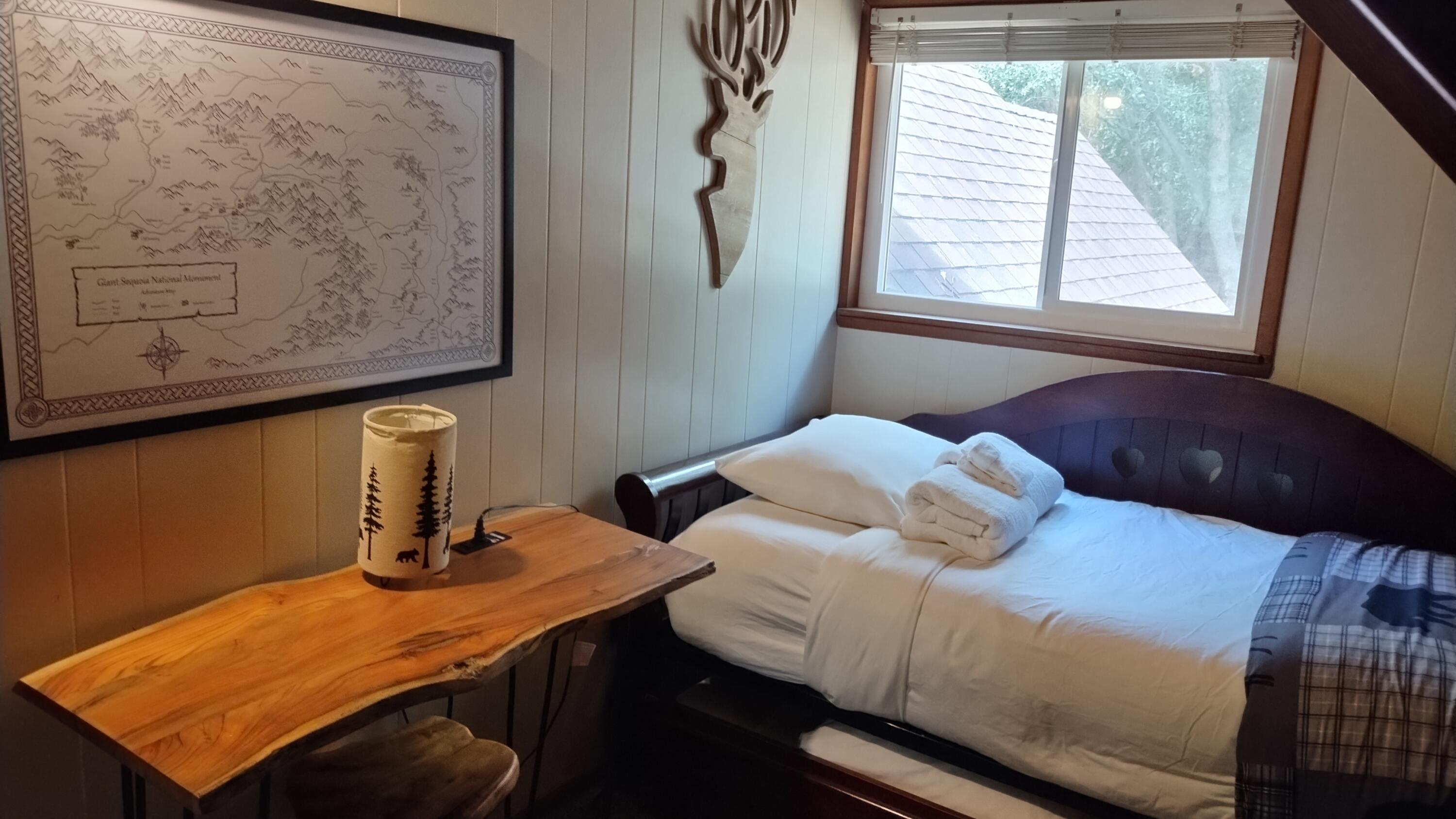 1693 Forest Rte 21S94 Camp Nelson, CA 93265 - Photo 52 of 86 a bedroom with a bed and a window