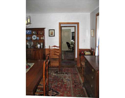 40 Chestnut Hill Road Orange, MA 01364 - Photo 12 of 22 a hallway with a view of living room with wooden floor
