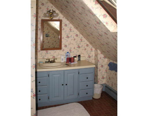 40 Chestnut Hill Road Orange, MA 01364 - Photo 17 of 22 a bathroom with a sink and a mirror