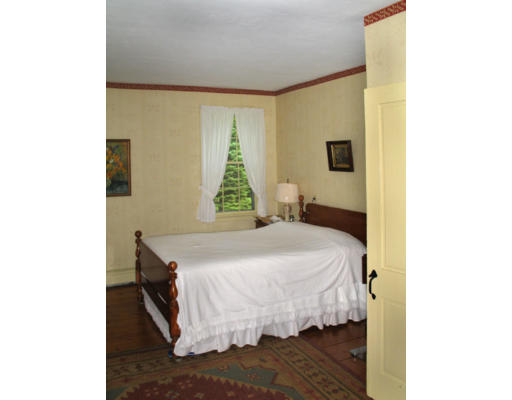 40 Chestnut Hill Road Orange, MA 01364 - Photo 18 of 22 a bed sitting in a bedroom next to a window