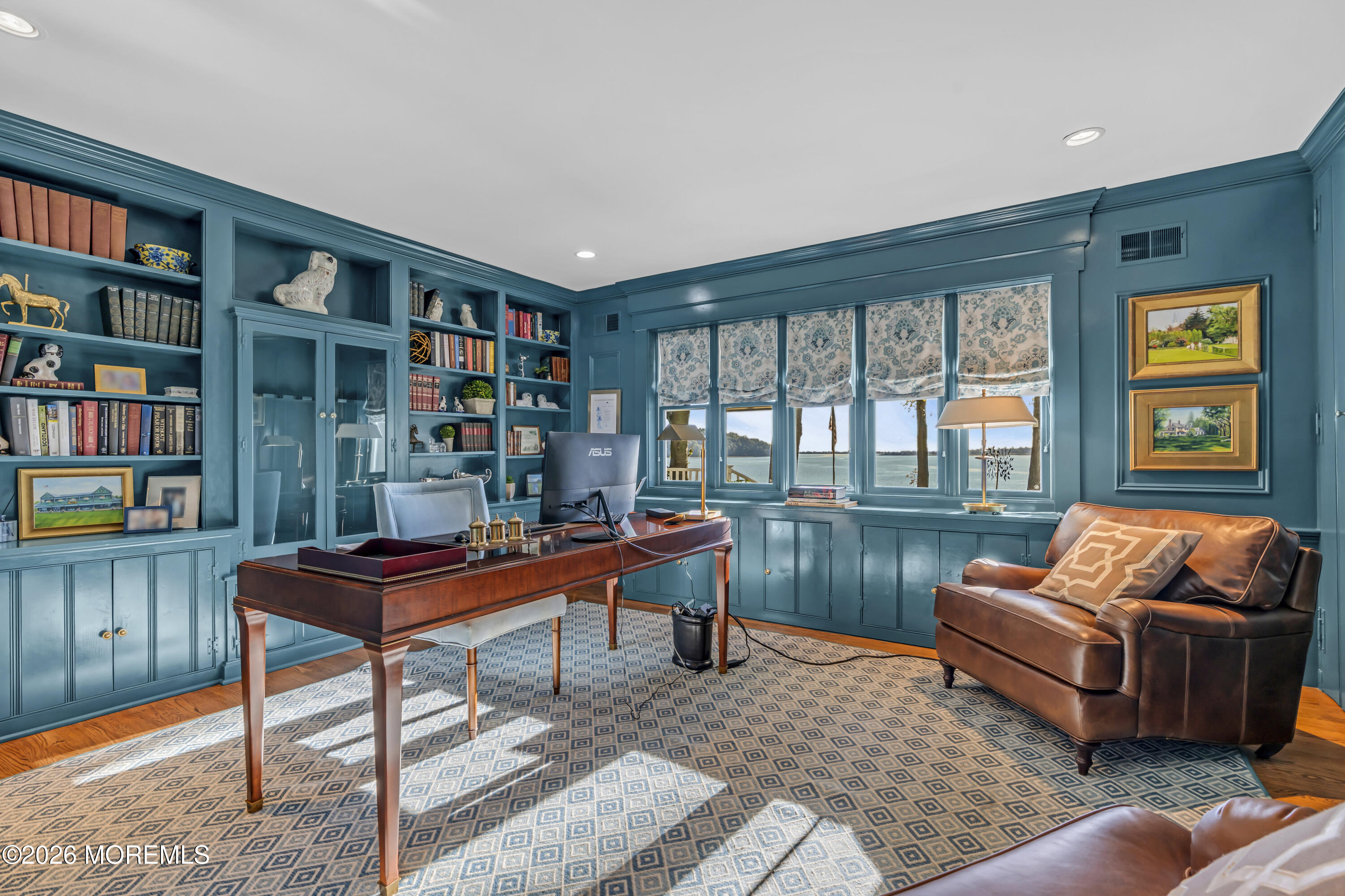 942 Navesink River Road Middletown, NJ 07760 - Photo 11 of 42 a reading room with furniture and a book shelf