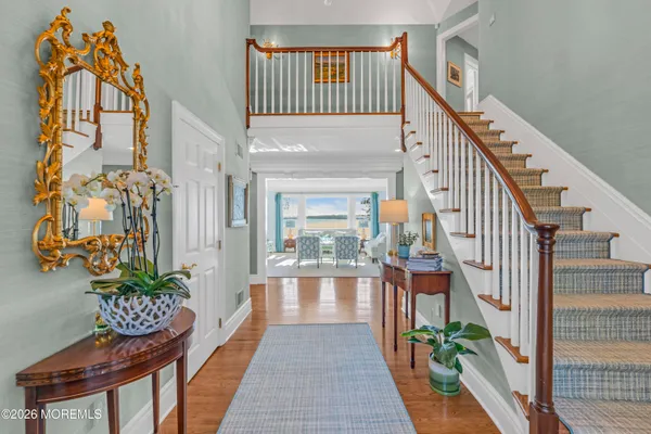 a view of entryway with wooden floor