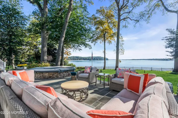 an outdoor sitting area with furniture and outdoor view