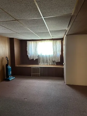 a bathroom with a toilet a sink and a mirror