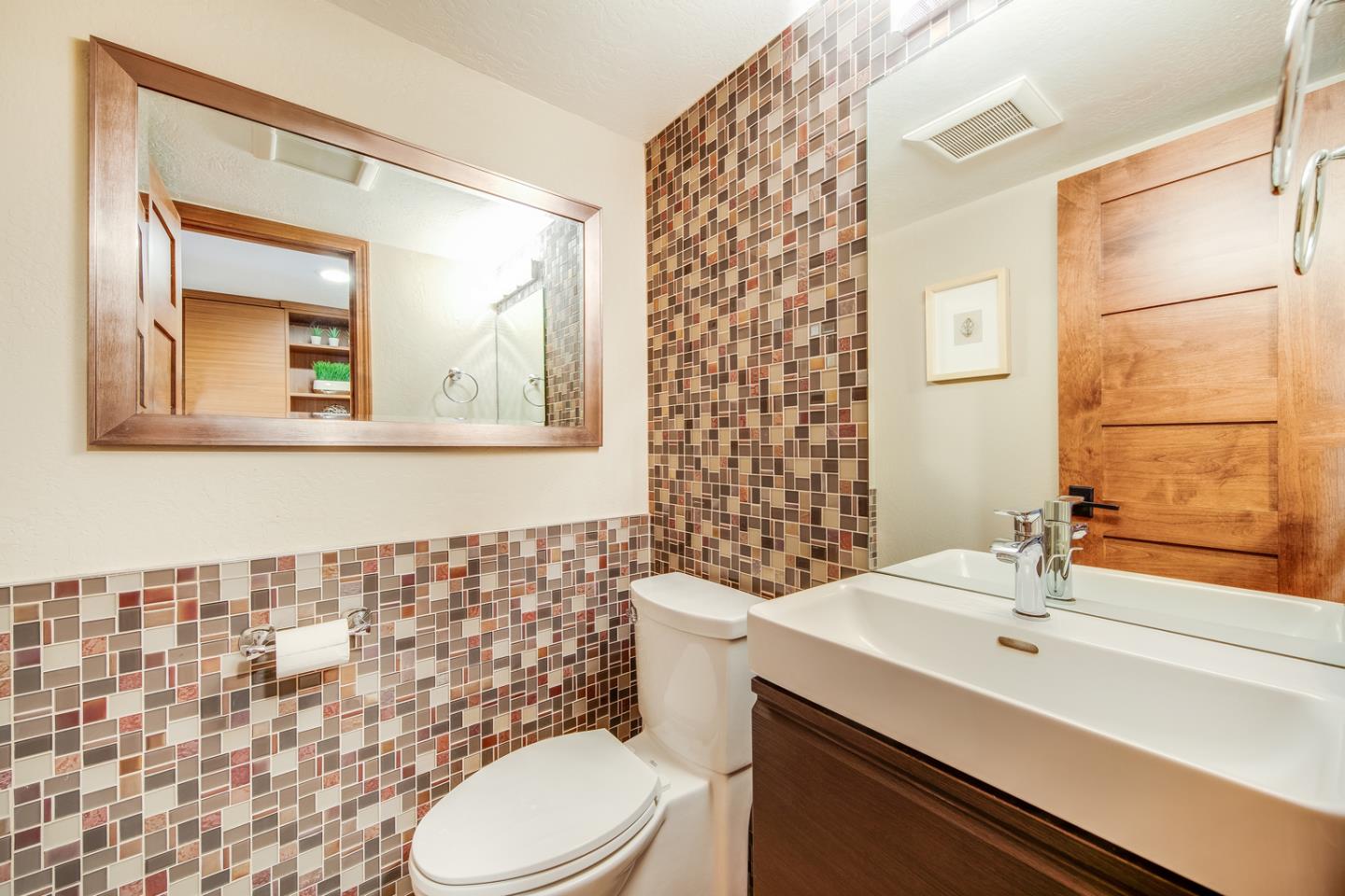 22832 Longdown Road Cupertino, CA 95014 - Photo 17 of 41 a bathroom with a sink a toilet and mirror