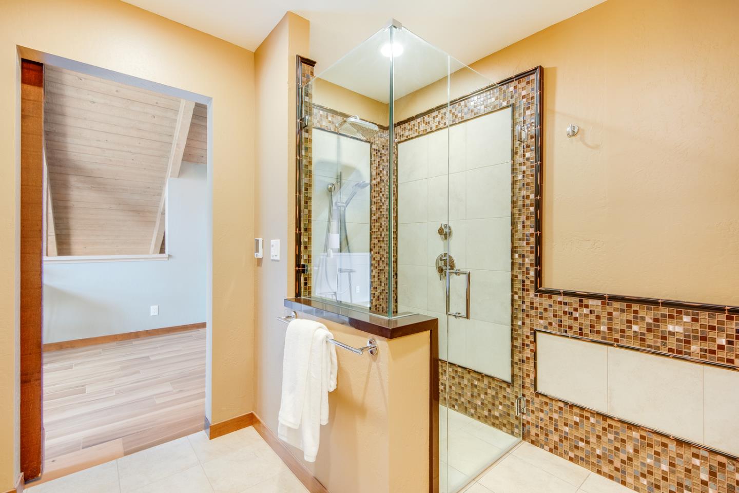 22832 Longdown Road Cupertino, CA 95014 - Photo 23 of 41 a bathroom with a glass shower door and a bathtub