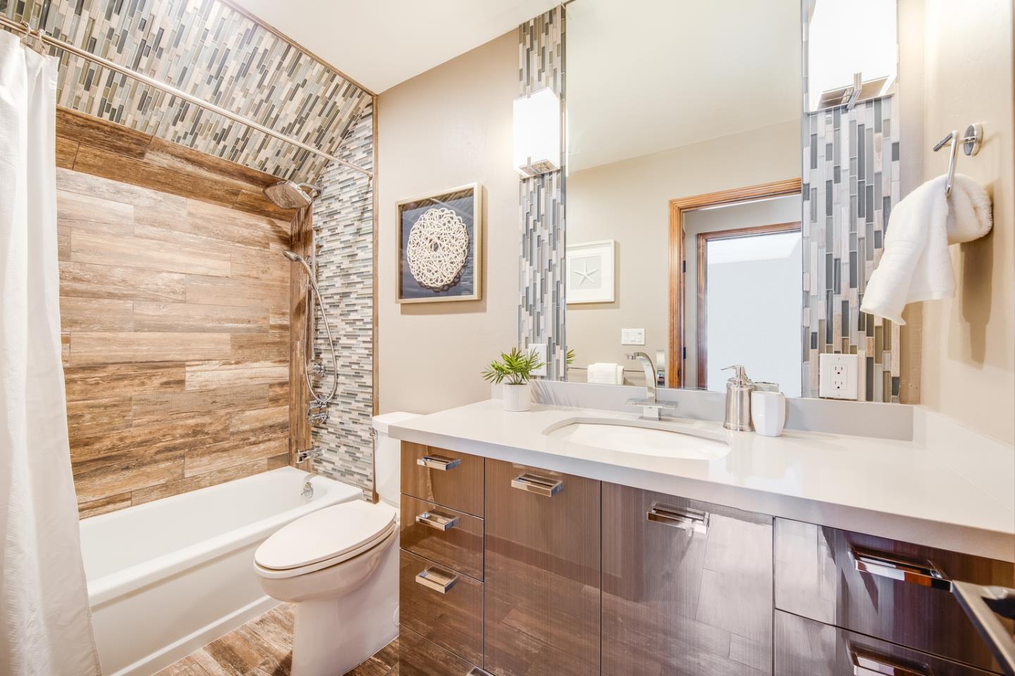 22832 Longdown Road Cupertino, CA 95014 - Photo 26 of 41 a bathroom with a granite countertop sink mirror vanity and toilet