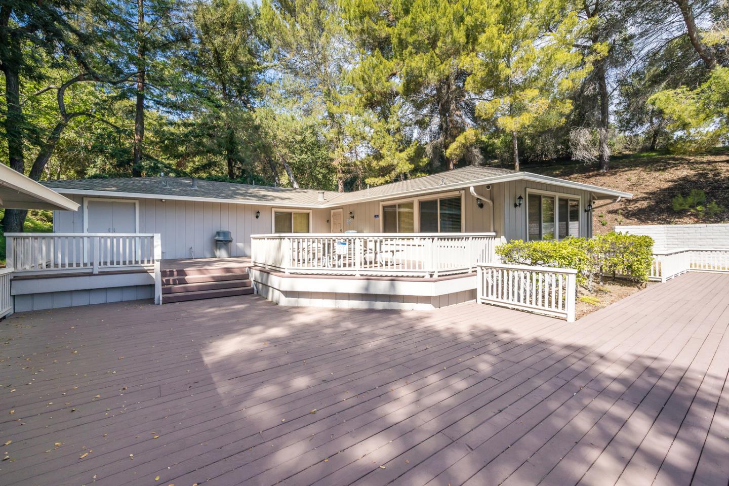 22832 Longdown Road Cupertino, CA 95014 - Photo 38 of 41 a view of a house with a patio and a yard