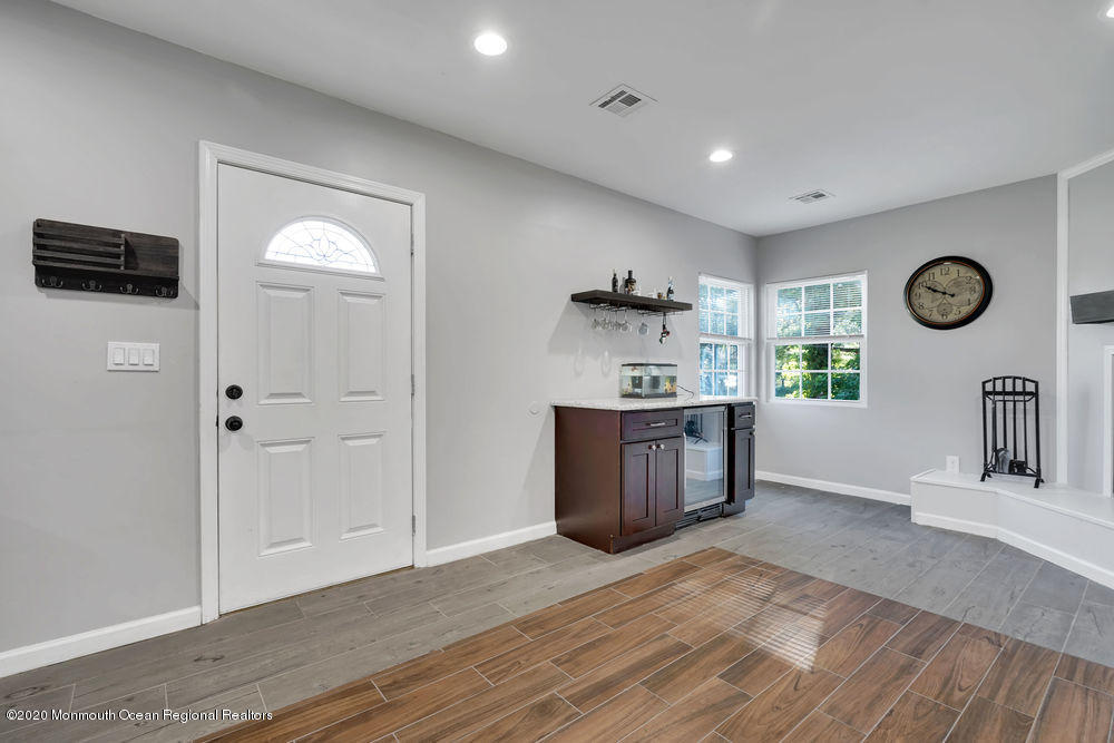 4 Nolan Road Morganville, NJ 07751 - Photo 12 of 46 a living room with stainless steel appliances kitchen island furniture and wooden floor