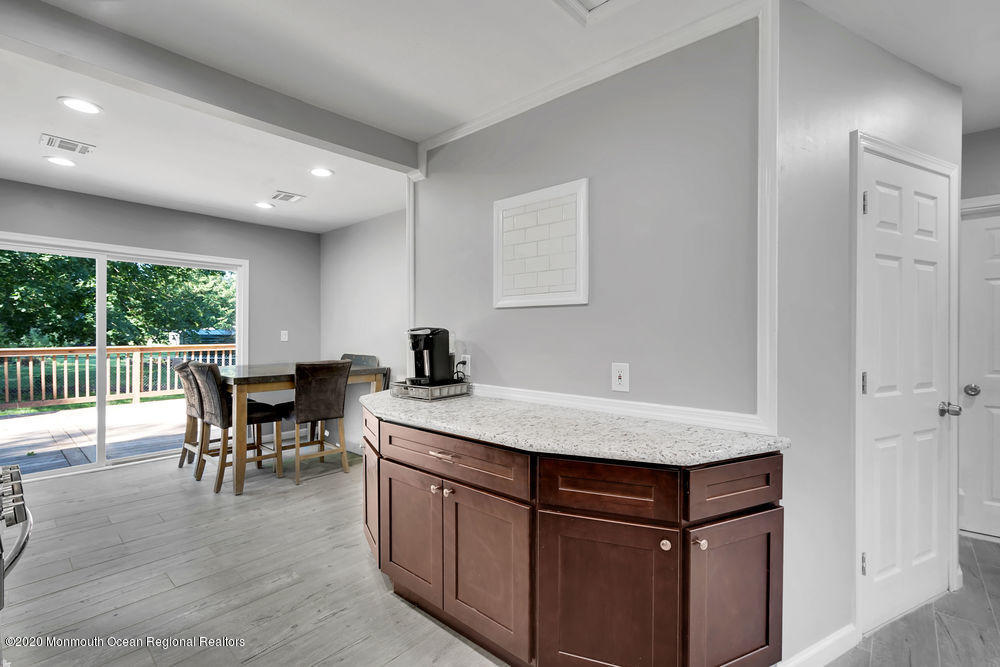 4 Nolan Road Morganville, NJ 07751 - Photo 14 of 46 a kitchen with a table chairs and a window