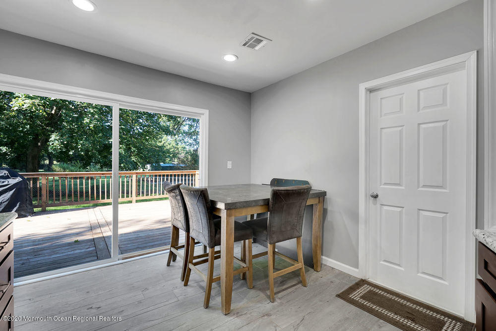 4 Nolan Road Morganville, NJ 07751 - Photo 16 of 46 a view of a dining room with furniture window and wooden floor