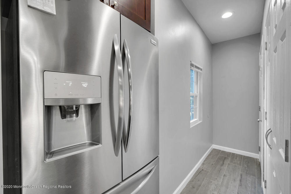 4 Nolan Road Morganville, NJ 07751 - Photo 19 of 46 a metallic refrigerator freezer and a refrigerator in a kitchen