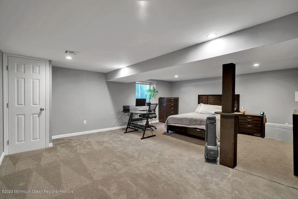 4 Nolan Road Morganville, NJ 07751 - Photo 25 of 46 a living room with furniture and a flat screen tv