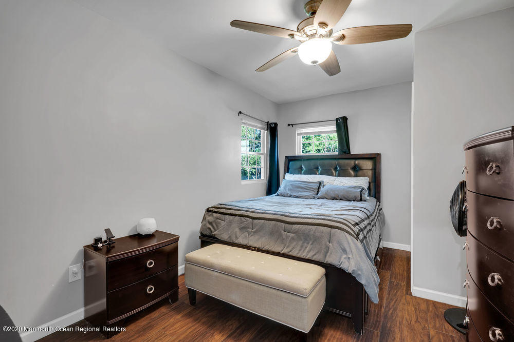 4 Nolan Road Morganville, NJ 07751 - Photo 26 of 46 a bedroom with a bed and wooden floor