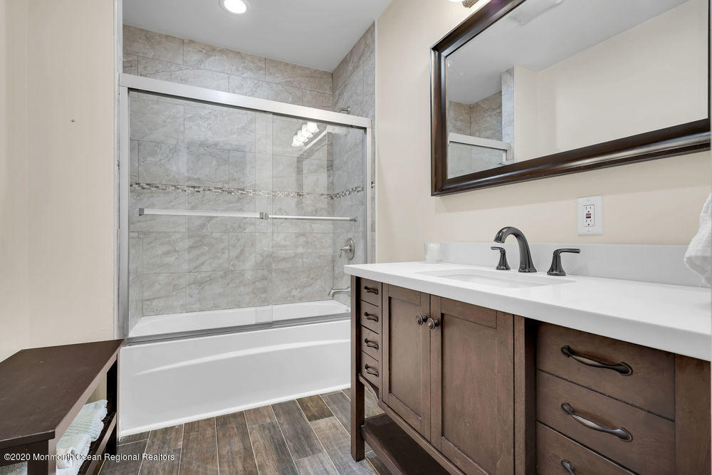 4 Nolan Road Morganville, NJ 07751 - Photo 27 of 46 a bathroom with a sink and a bathtub