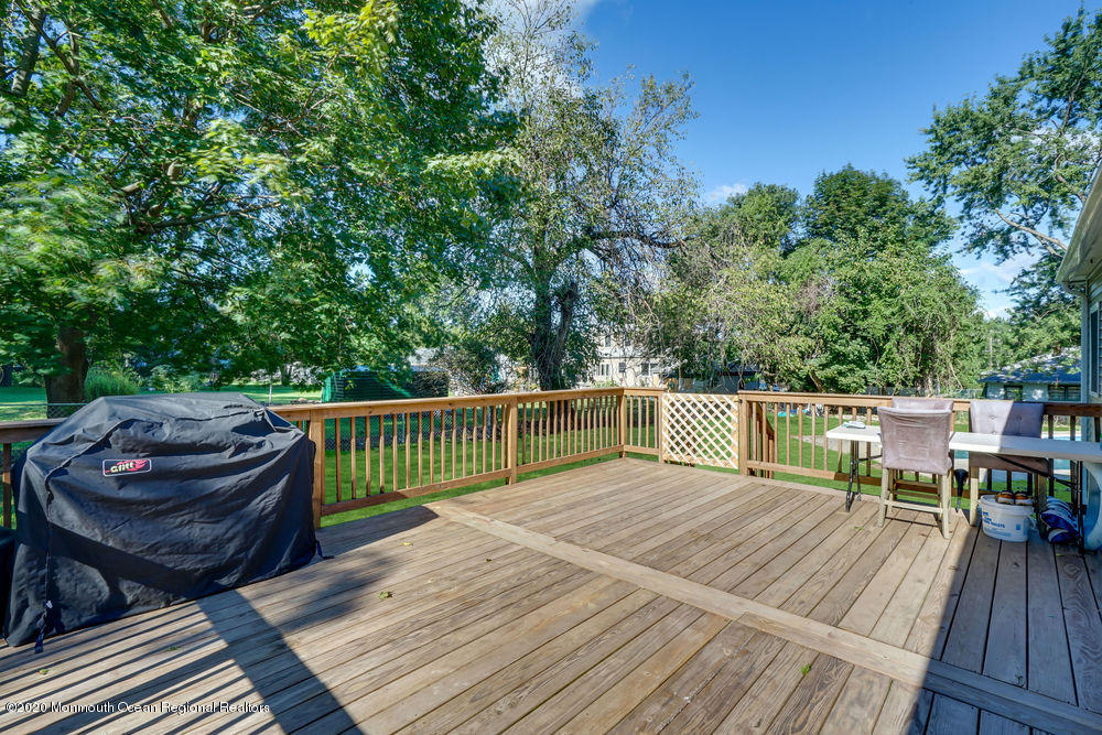 4 Nolan Road Morganville, NJ 07751 - Photo 33 of 46 a view of balcony with deck and outdoor seating