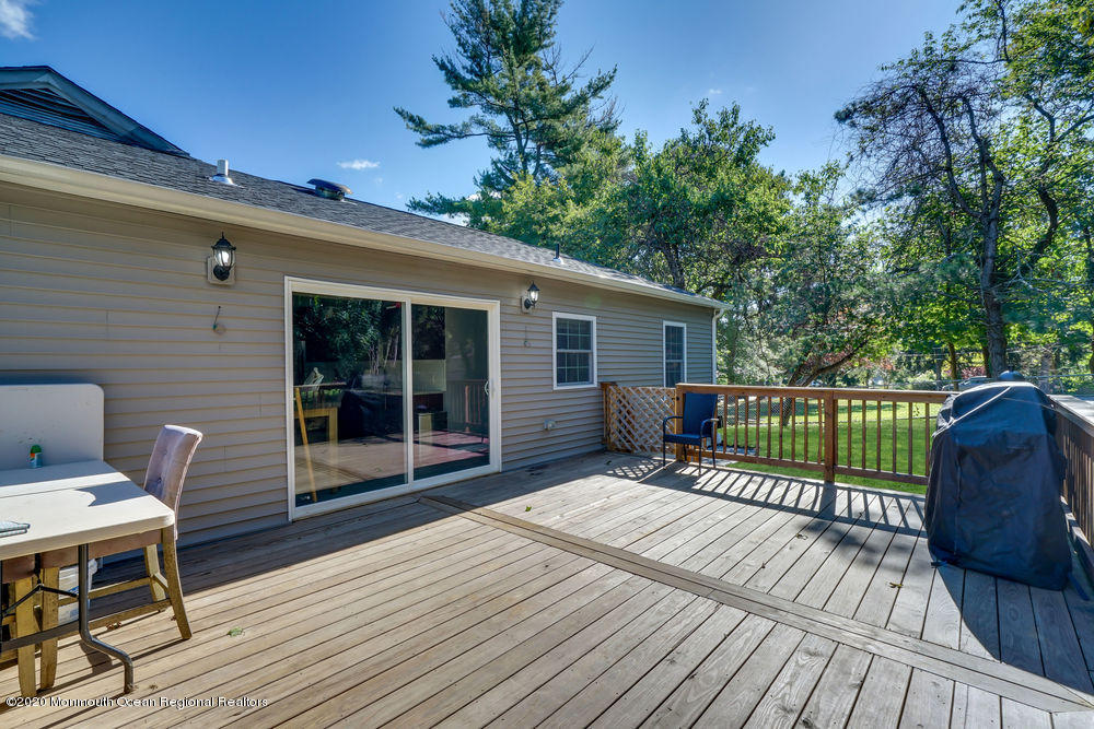 4 Nolan Road Morganville, NJ 07751 - Photo 35 of 46 a view of a deck with wooden floor and outdoor seating