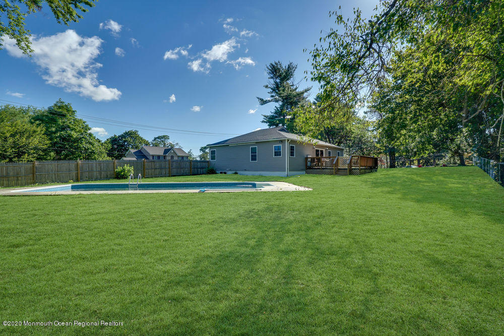 4 Nolan Road Morganville, NJ 07751 - Photo 38 of 46 a house view with swimming pool in front of it