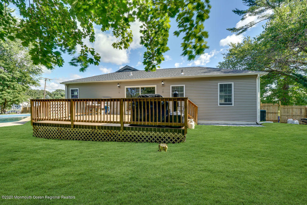 4 Nolan Road Morganville, NJ 07751 - Photo 41 of 46 a view of a house with a yard and deck