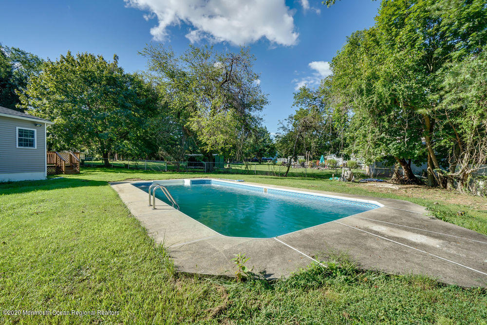 4 Nolan Road Morganville, NJ 07751 - Photo 45 of 46 a view of a swimming pool with a yard