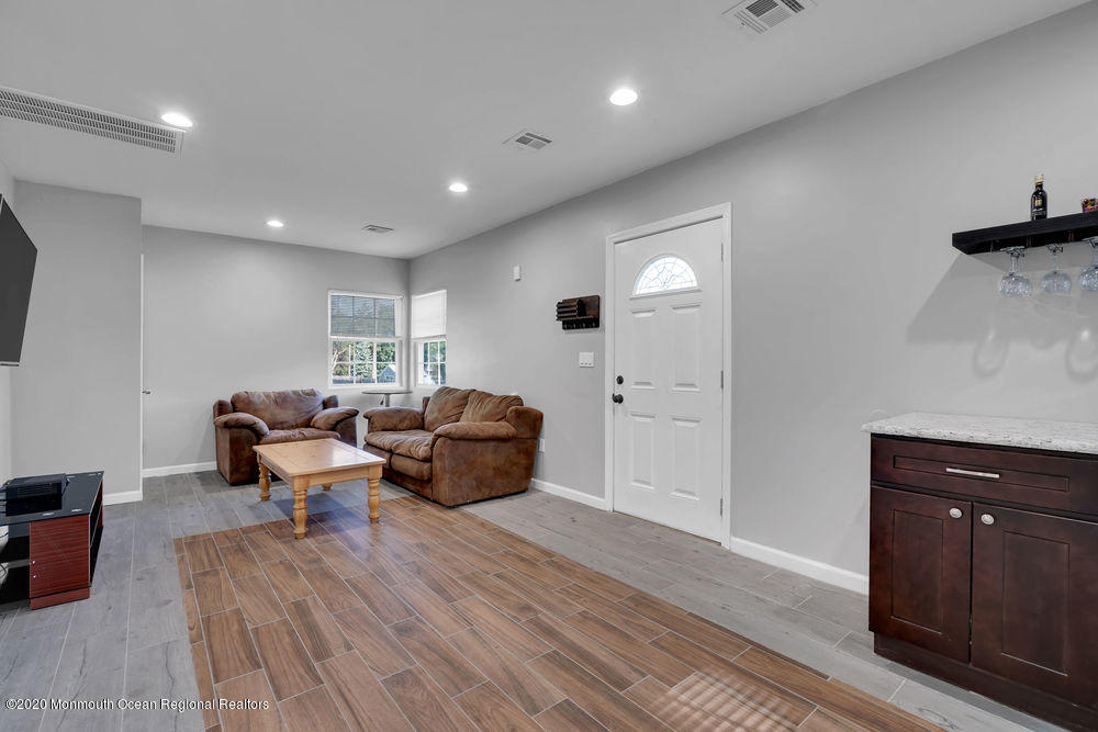 4 Nolan Road Morganville, NJ 07751 - Photo 6 of 46 a living room with furniture and wooden floor