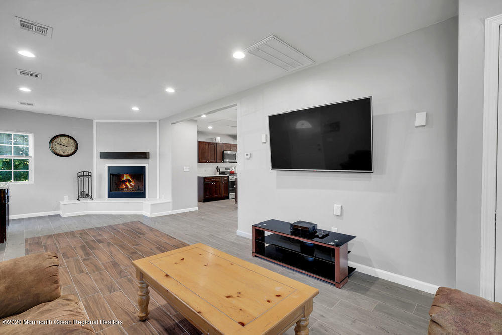 4 Nolan Road Morganville, NJ 07751 - Photo 9 of 46 a living room with furniture and a flat screen tv