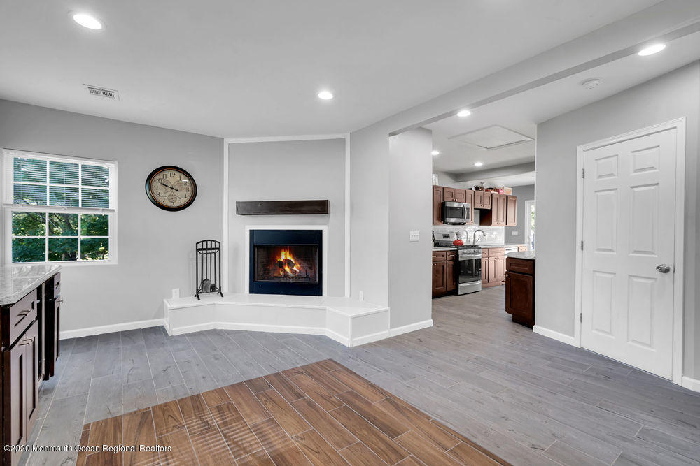 4 Nolan Road Morganville, NJ 07751 - Photo 10 of 46 a view of an empty room with a fireplace and a window