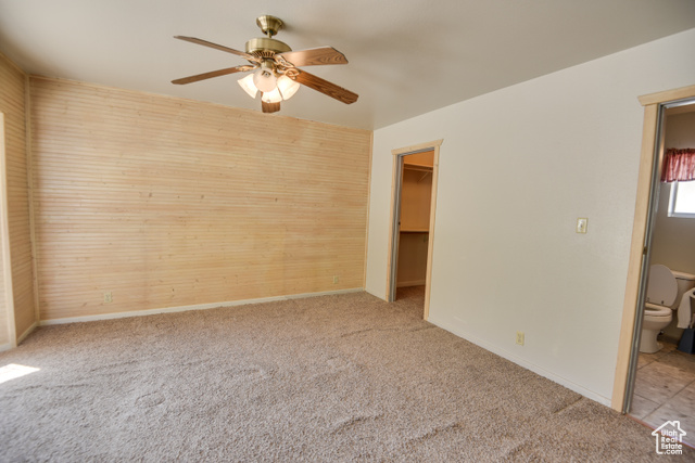 2373 East 190 North Beaver, UT 84713 - Photo 32 of 54 Unfurnished bedroom featuring carpet flooring, a spacious closet, a ceiling fan, and connected bathroom
