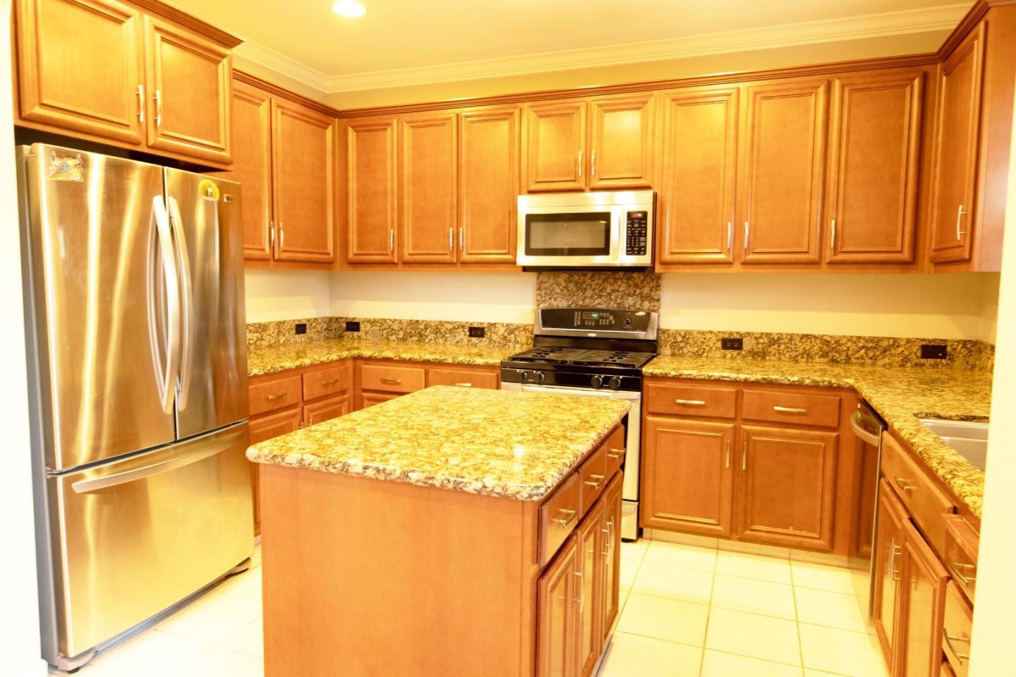 7754 Stoneleaf Road San Ramon, CA 94582 - Photo 13 of 25 a kitchen with stainless steel appliances granite countertop a refrigerator sink and cabinets