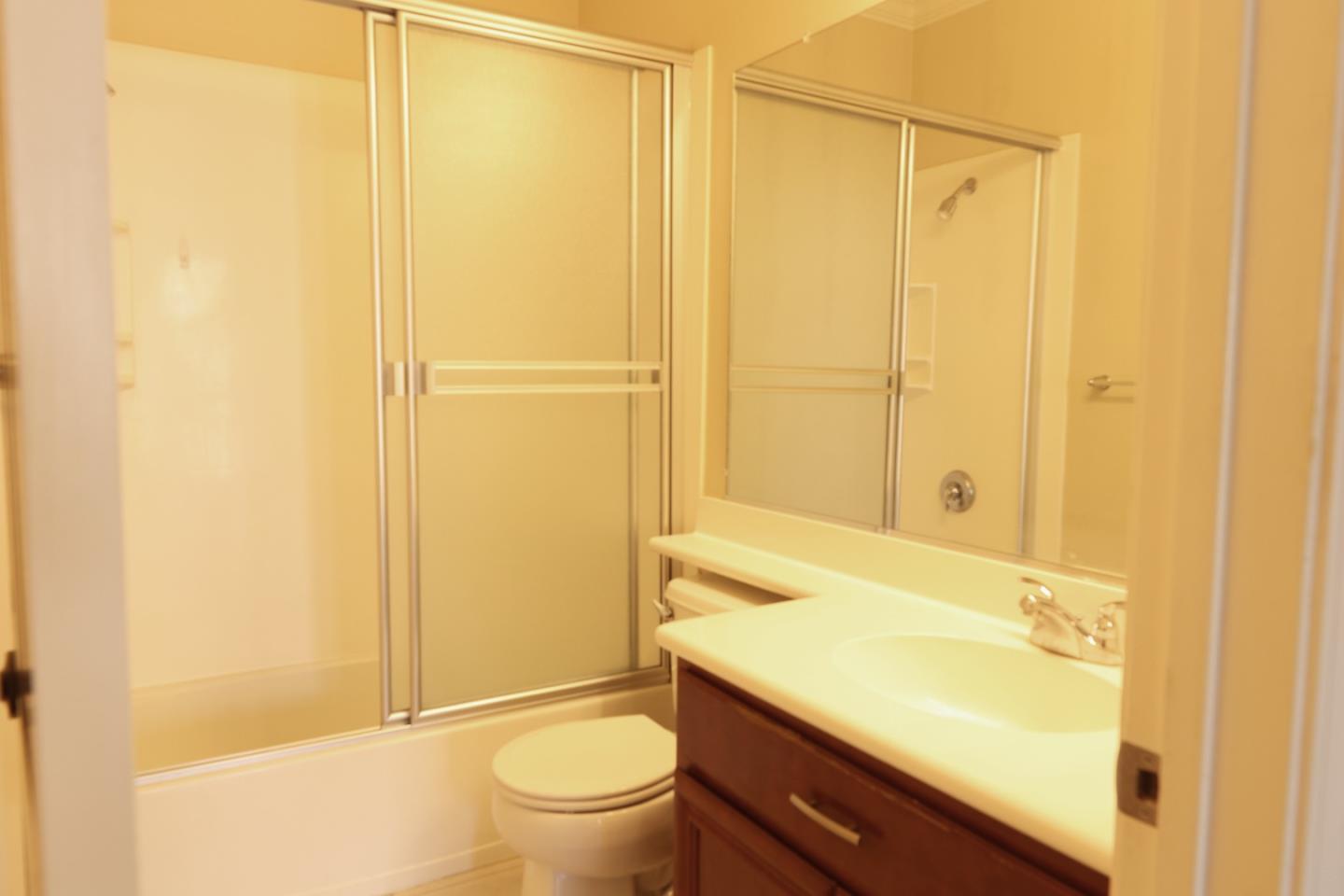7754 Stoneleaf Road San Ramon, CA 94582 - Photo 19 of 25 a bathroom with a granite countertop sink toilet and shower