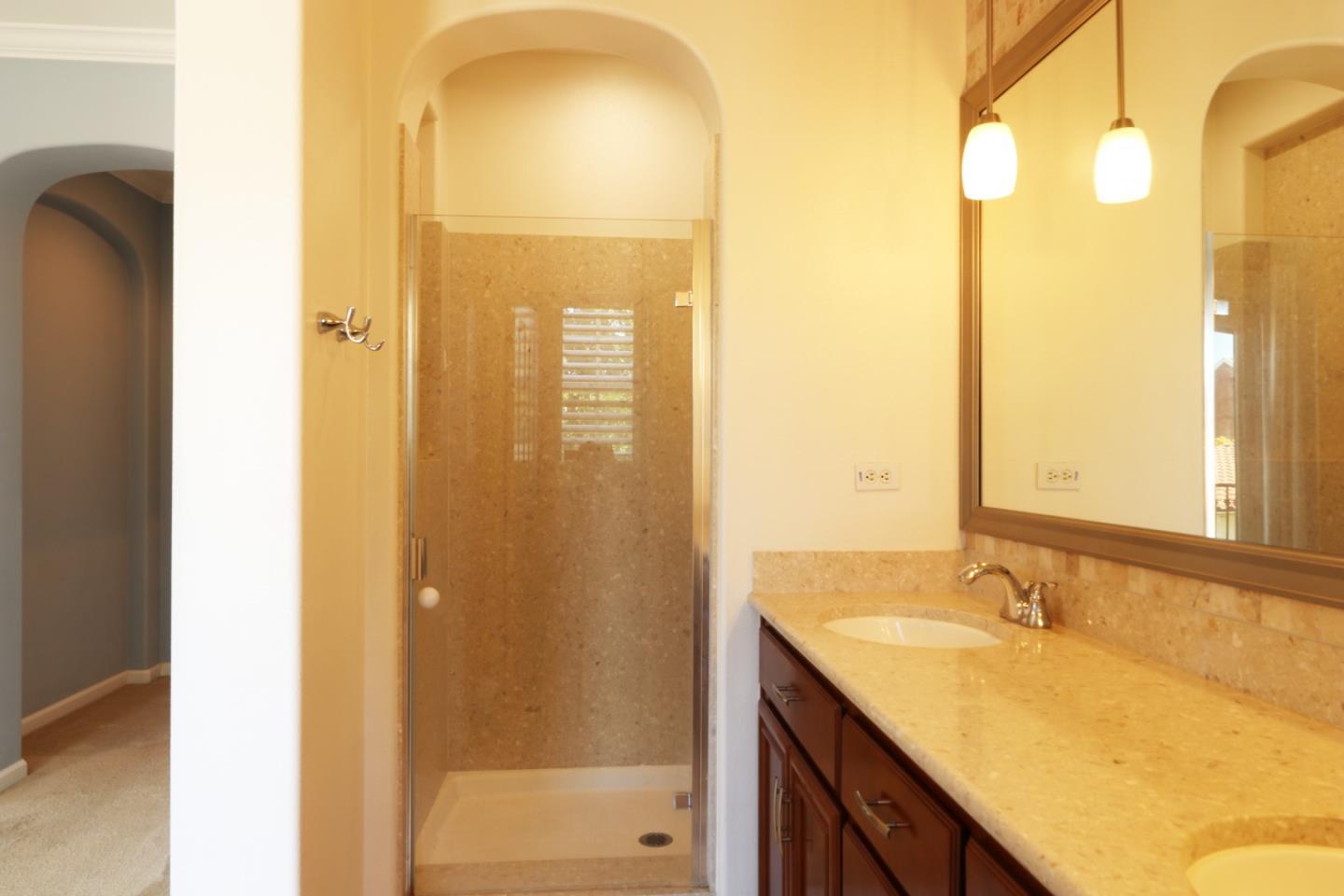 7754 Stoneleaf Road San Ramon, CA 94582 - Photo 22 of 25 a bathroom with a granite countertop sink and a mirror