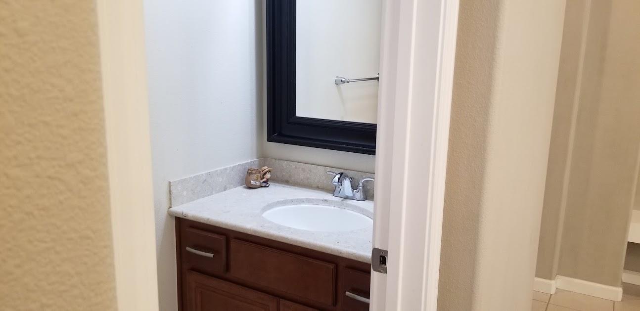 7754 Stoneleaf Road San Ramon, CA 94582 - Photo 9 of 25 a bathroom with a sink and a mirror
