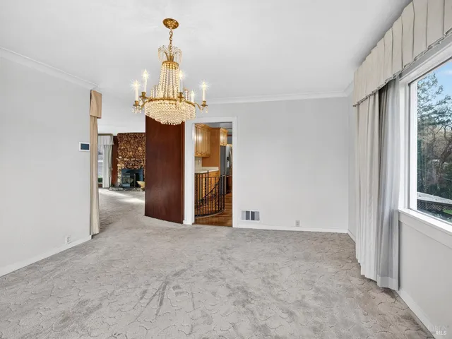 a view of a chandelier and window in a room