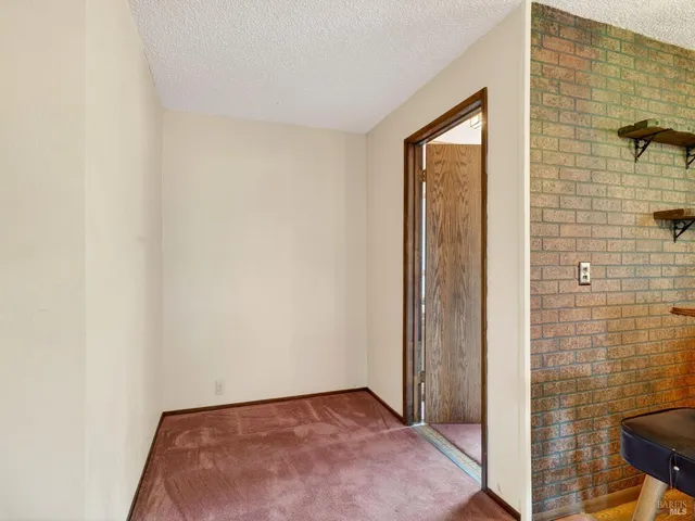 a front view of a house with a large window