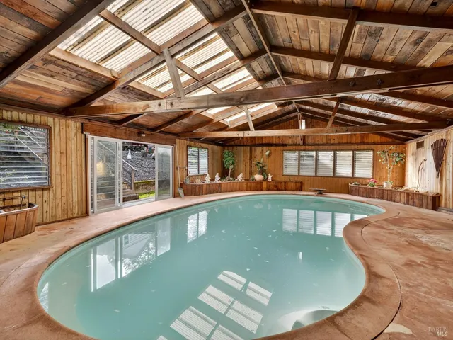 a view of a backyard with large trees