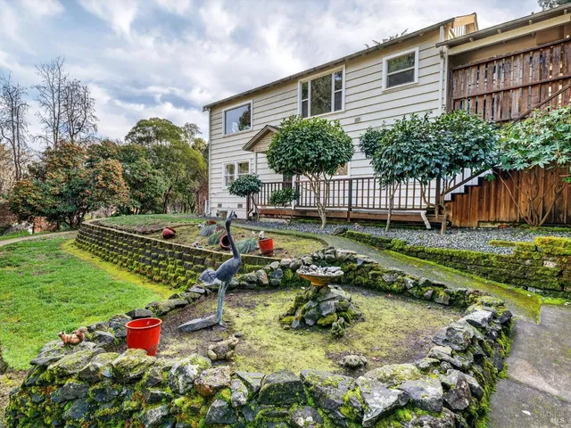 a view of park with large trees