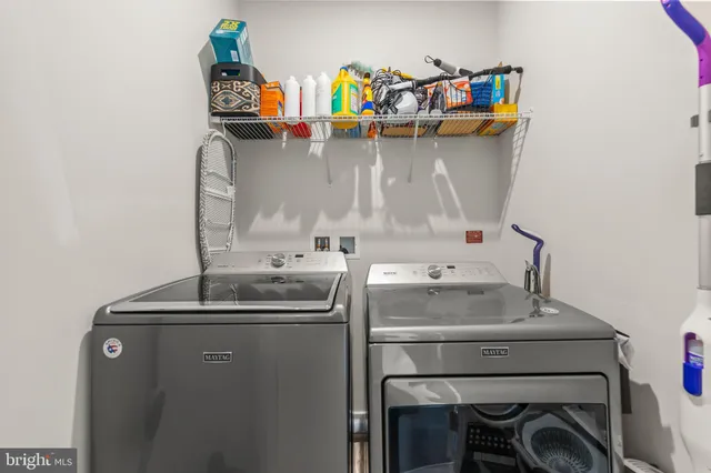 a large bed sitting in a bedroom next to a window